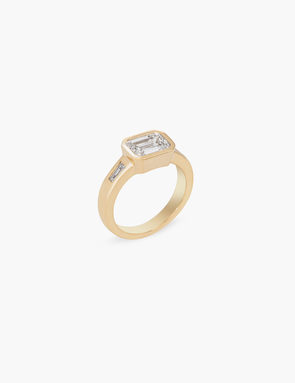 Emerald cut ring with tapered baguettes